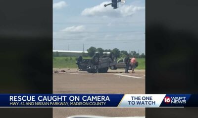 Bystanders jump into action after rollover wreck