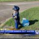 Young officer hands out water to first responders in Water Valley