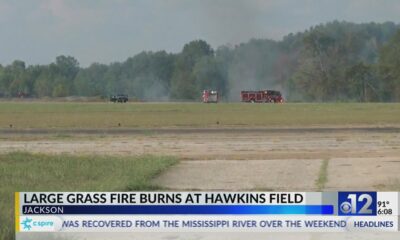 Large grass fire burns at Hawkins Field