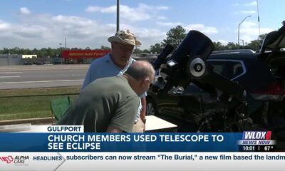 Church members in Gulfport use telescope to see eclipse