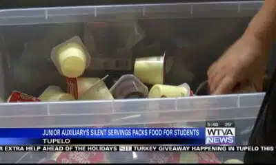 Junior Auxiliary in Tupelo packs food for students