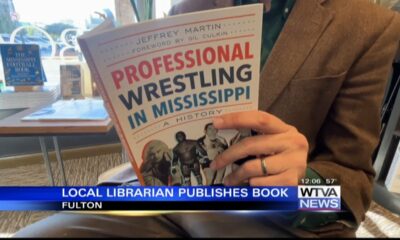 Local librarian publishes book about wrestling