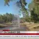 Water spews from Dabney Drive in Jackson