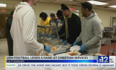 USM football players serve hot meals at Christian Services