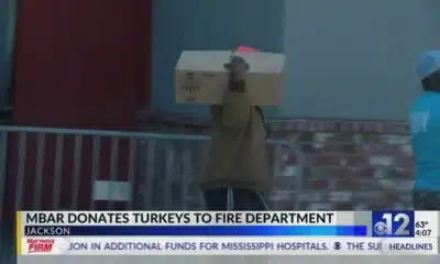 M-Bar donates turkeys to fire department