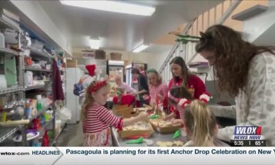 Families bond and make cookies for Santa at Sweet Enchantments Bakery