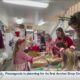 Families bond and make cookies for Santa at Sweet Enchantments Bakery