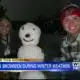 Folks take advantage of the little snow we received and make snowmen