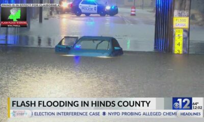Vehicle submerged due to flooding in Jackson