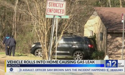 Vehicle rolls into Jackson home, causes gas leak