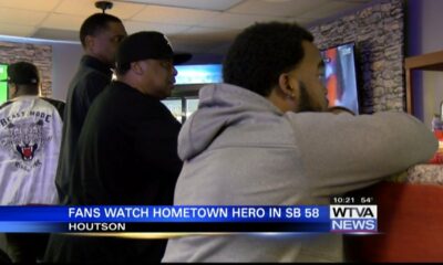 People from Houston watch their hometown hero win his third Super Bowl ring