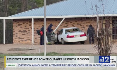 Car crashes into Jackson building, causes outage