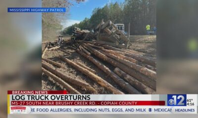 Log truck overturns on Copiah County highway