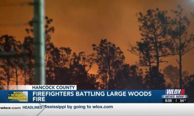 Firefighters battling large woods fire in Hancock County