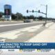 LIVE: Plan enacted to keep sand off Highway 90