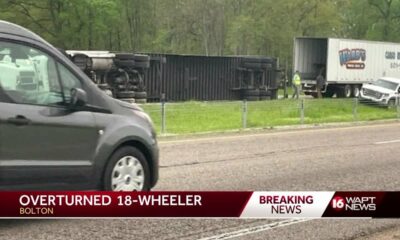 Cleanup underway after truck overturns near Bolton