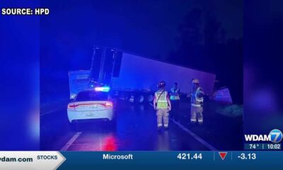 Overturned tractor trailer damages bridge on I-59N