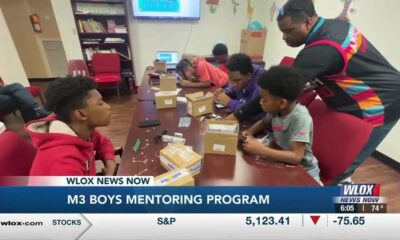 Engineers work to teach young men about the nuts and bolts of technology