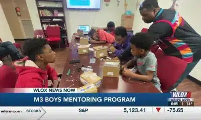 Engineers work to teach young men about the nuts and bolts of technology
