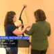 Chelsea Simmons and Tanya Carter show off their archery skills