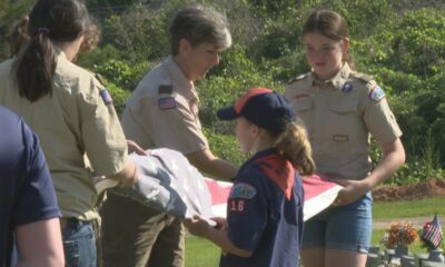 Area Boy Scout troops raise new American flag at Magnolia Cemetery