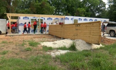 Volunteers assisting Habitat for Humanity