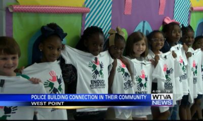 West Point police officers bonding with local kids through free shirts