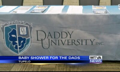 Families attend a baby shower for dads and dads-to-be.