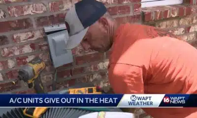 AC repairmen working overtime during heatwave