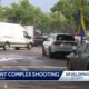 2 people in custody after apartment shooting