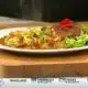 Salute owner Rob Stinson celebrates Karen's retirement by cooking her favorite dish