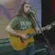 Adam Harbison performs