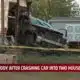 One in custody after crashing car into two houses