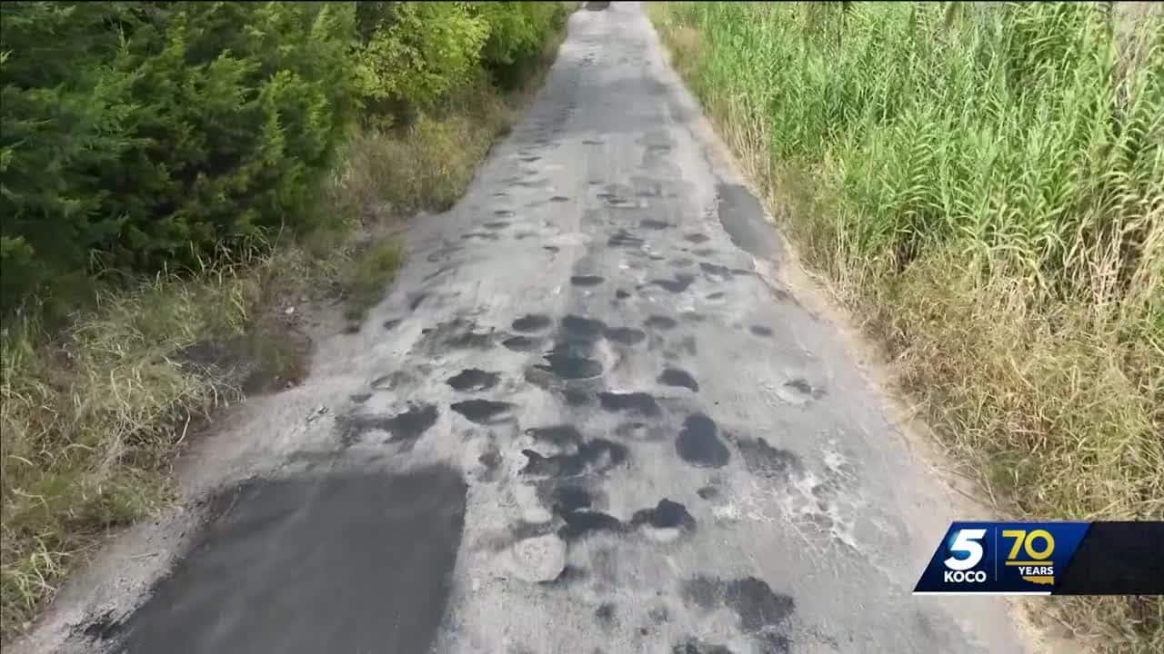 Neighborhood fed up with potholes on road with overlapping boundaries