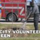 Volunteers go green by planting trees at Lake City schools