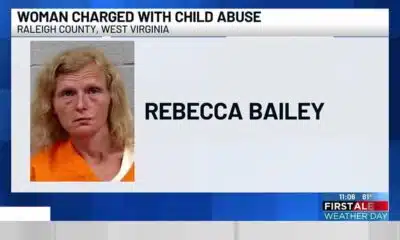Woman charged with child abuse