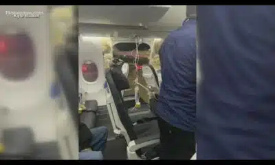 Investigators break down door blowing off Boeing 737