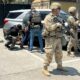 National Guard soldiers deployed this month to Los Angeles guard ICE agents during an immigration enforcement operation.