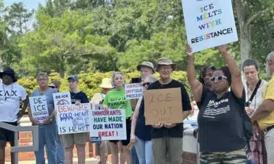 Activists gathered outside the Chesterfield County courthouse this week to protest against the arrests of immigrants by federal agents. (Photo by Markus Schmidt/Virginia Mercury)