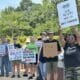 Activists gathered outside the Chesterfield County courthouse this week to protest against the arrests of immigrants by federal agents. (Photo by Markus Schmidt/Virginia Mercury)