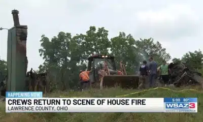 Crews return to scene of house fire