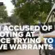 Man accused of shooting at police who were trying to serve warrants in murder investigation