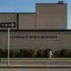 A Midland ISD employee walks past the front of Legacy High School on Thursday, Aug. 7, 2025, in Midland.